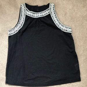 Black cotton tank with white eyelet embroidery.